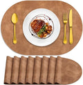 ADRIMER Oval Placemats Set of 8, Wipeable Faux Leather, Sandy Light Brown