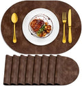 ADRIMER Oval Placemats Set of 8, Wipeable Faux Leather, Brown