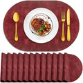 ADRIMER Oval Placemats Set of 12, Wipeable Faux Leather, Wine Red